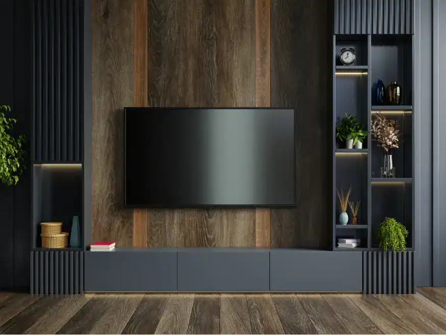 A luxurious dark wood media wall and entertainment center with vertical paneling, open shelving with accent lighting, and a large mounted television.