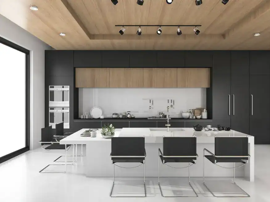 A high-contrast, modern kitchen with black and white flat-panel cabinets, a large white island, and a light wood-paneled ceiling.